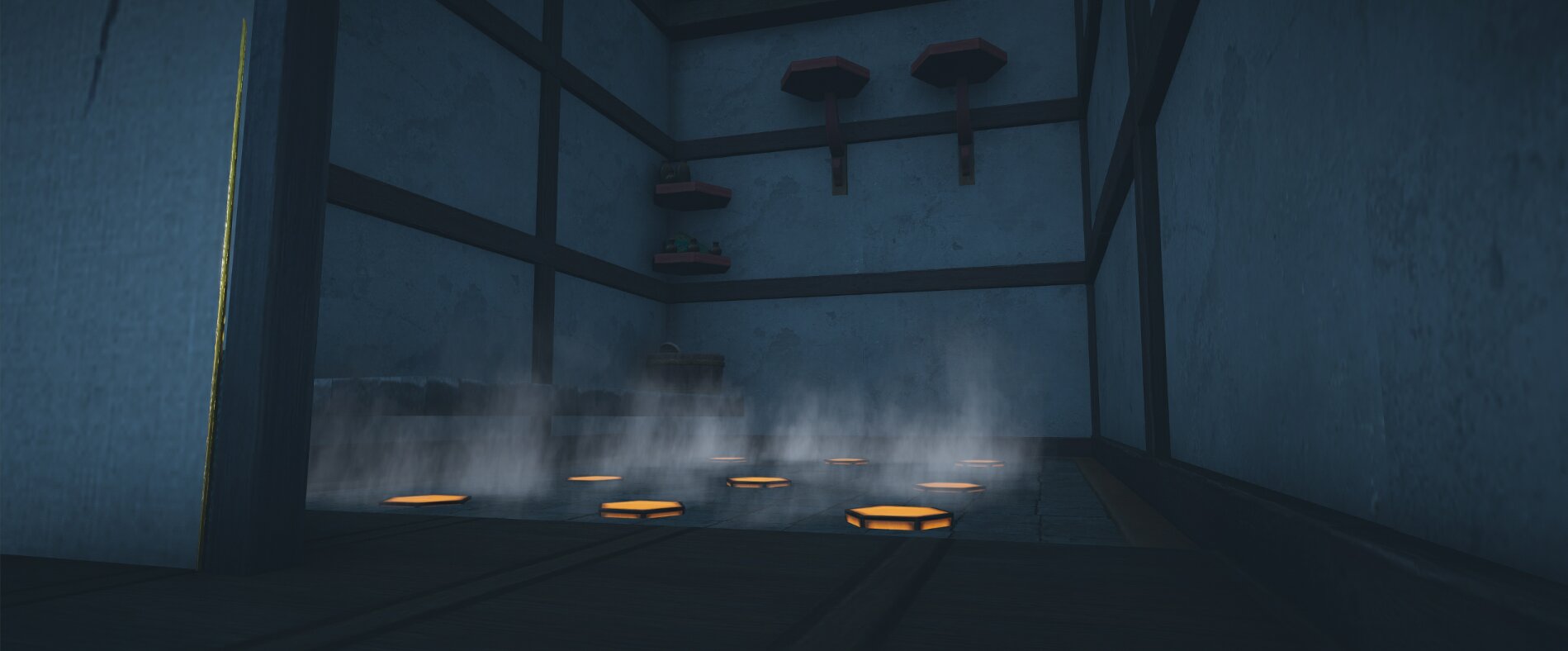 Dark room with heating pads on the floor producing rising steam